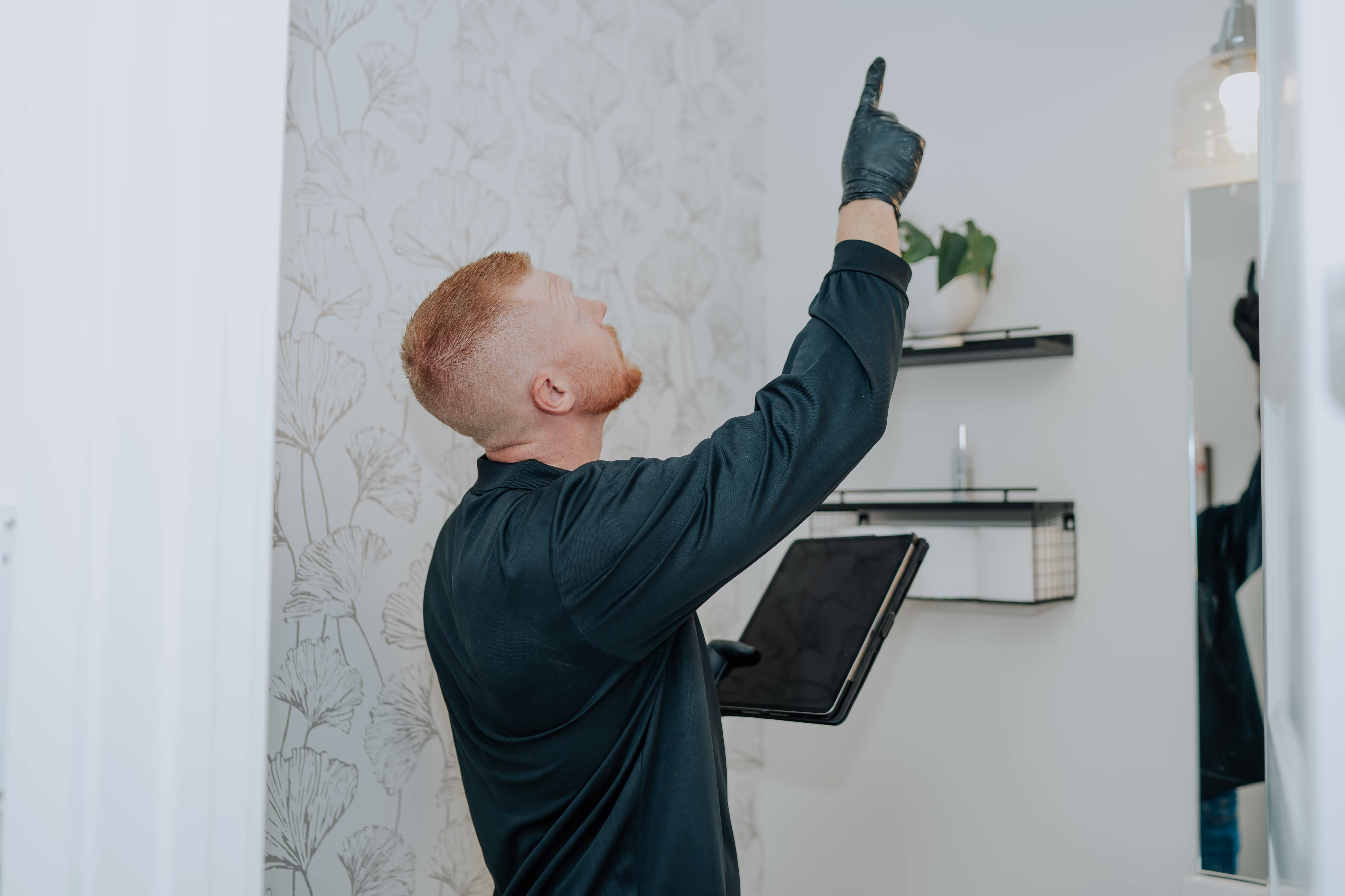 Technician surveying a commercial property for mold